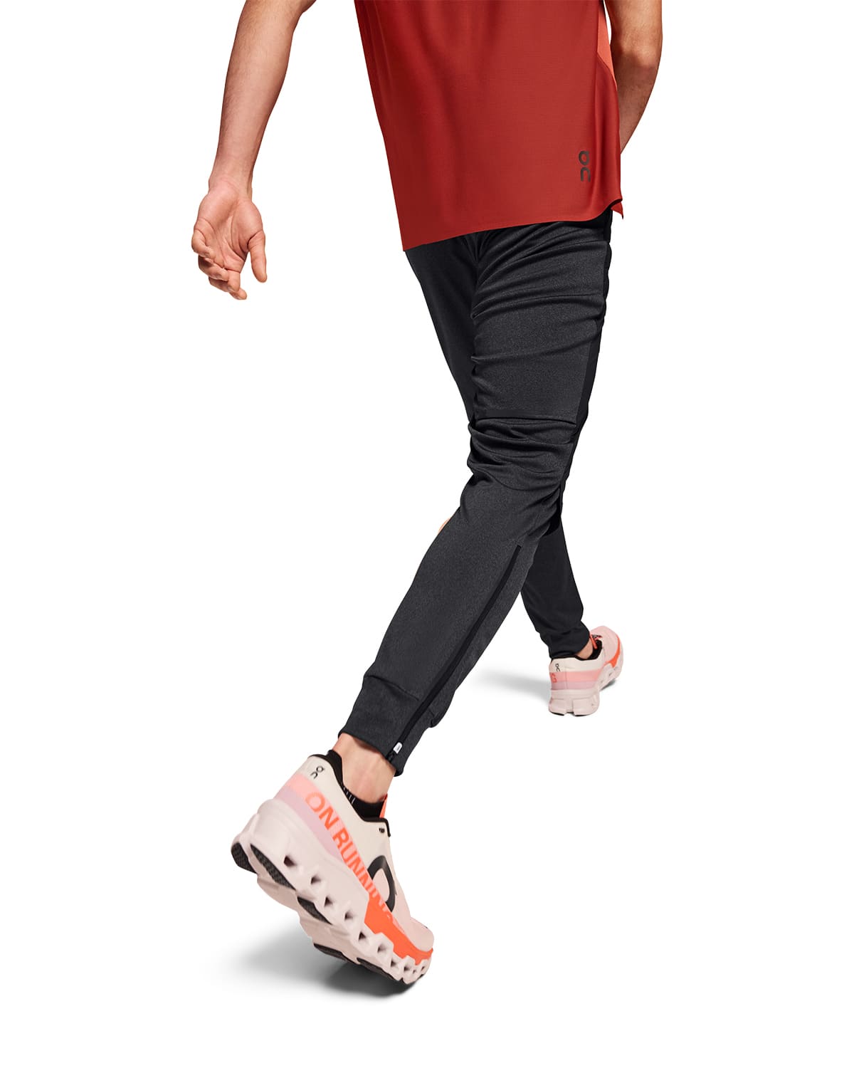 Man wearing the On Weather Pants Colour Black - Back View Motion