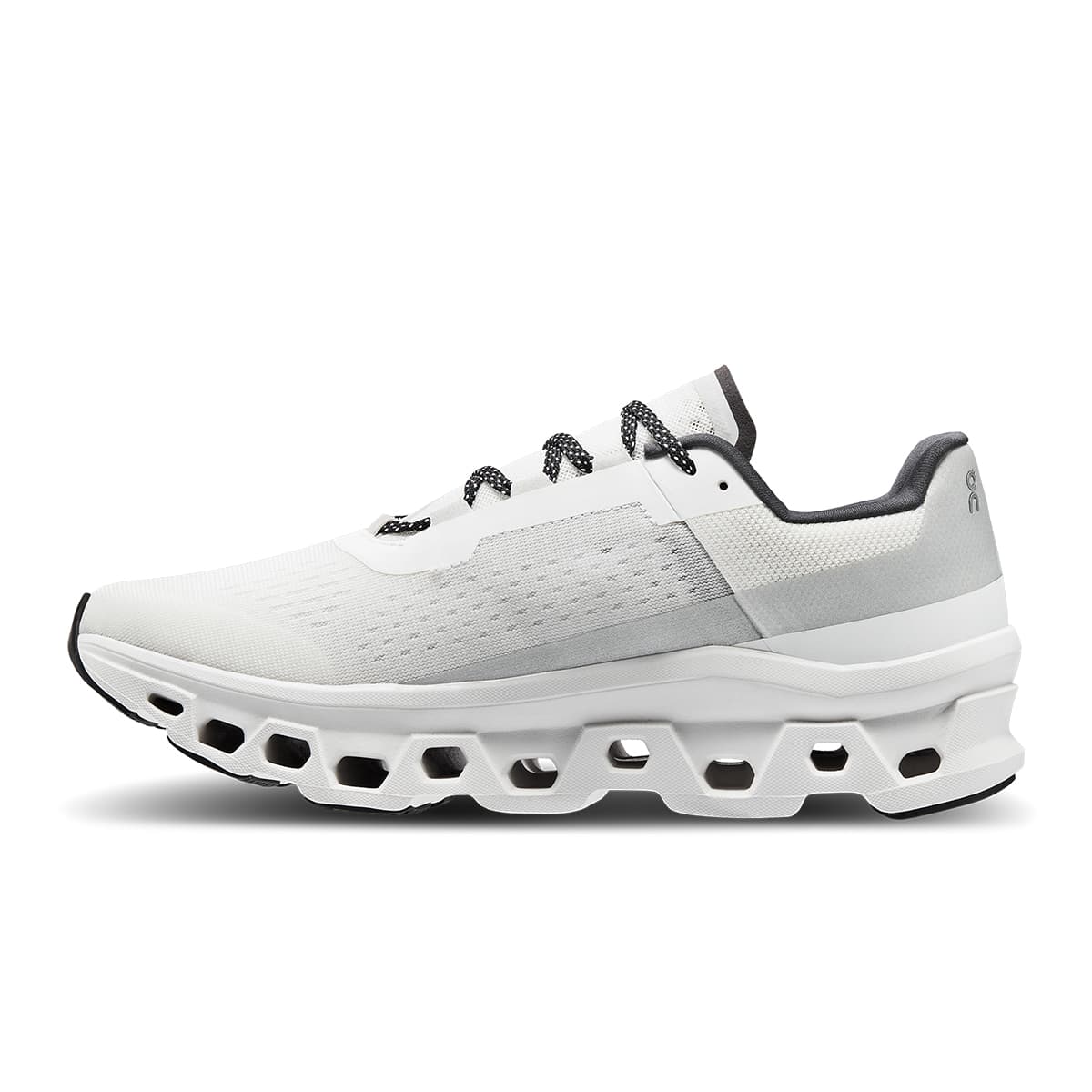 Left side view of the On Cloudmonster All White women’s running shoe