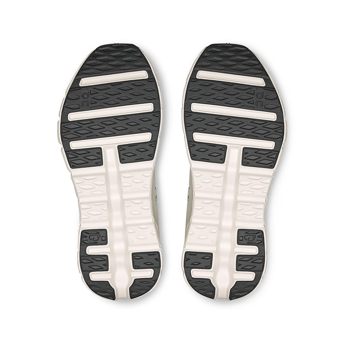 Soles of the On Cloudtilt Arctic-Ice women’s running shoes