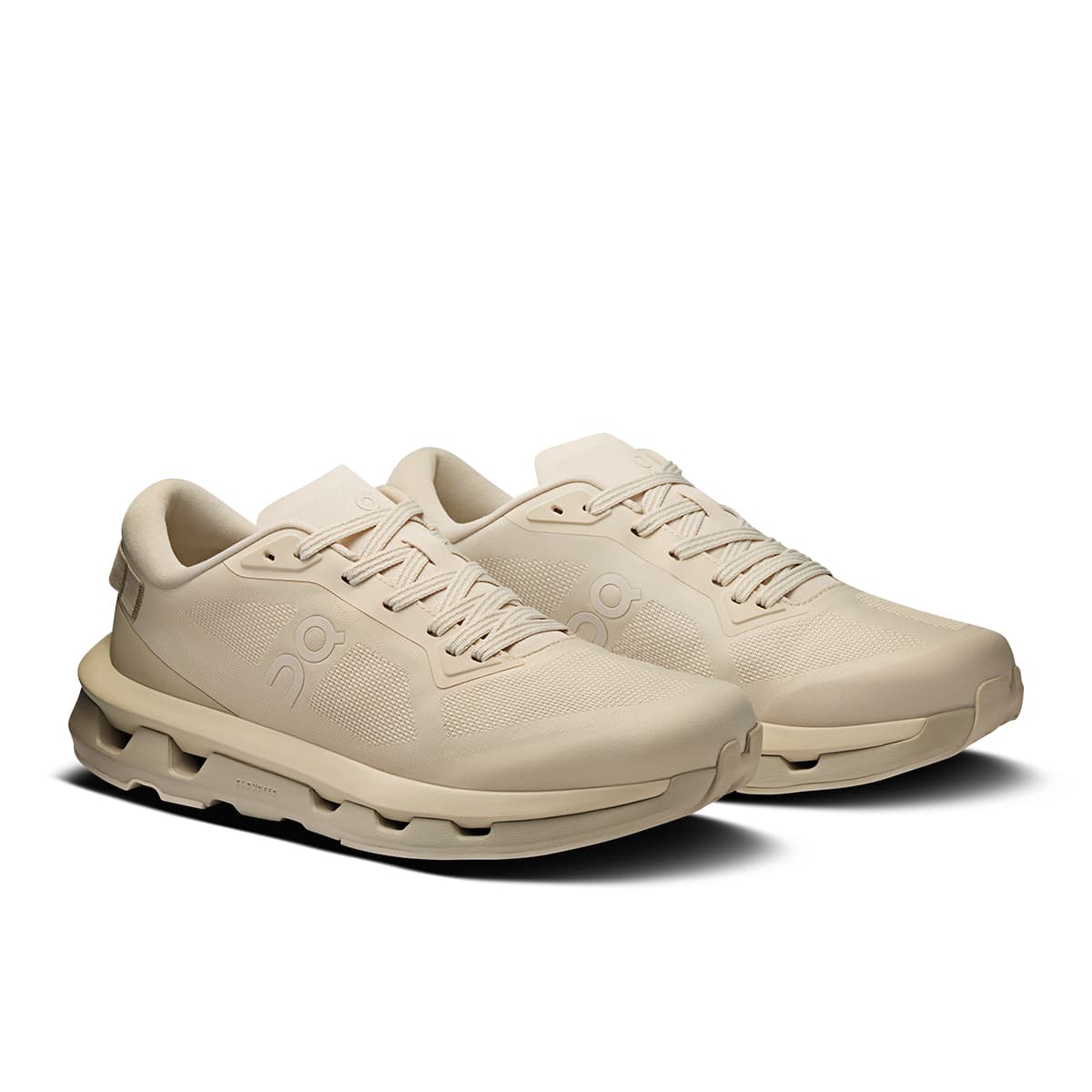 45-degree view of the On Cloudzone Pearl-Truffle women’s running shoe