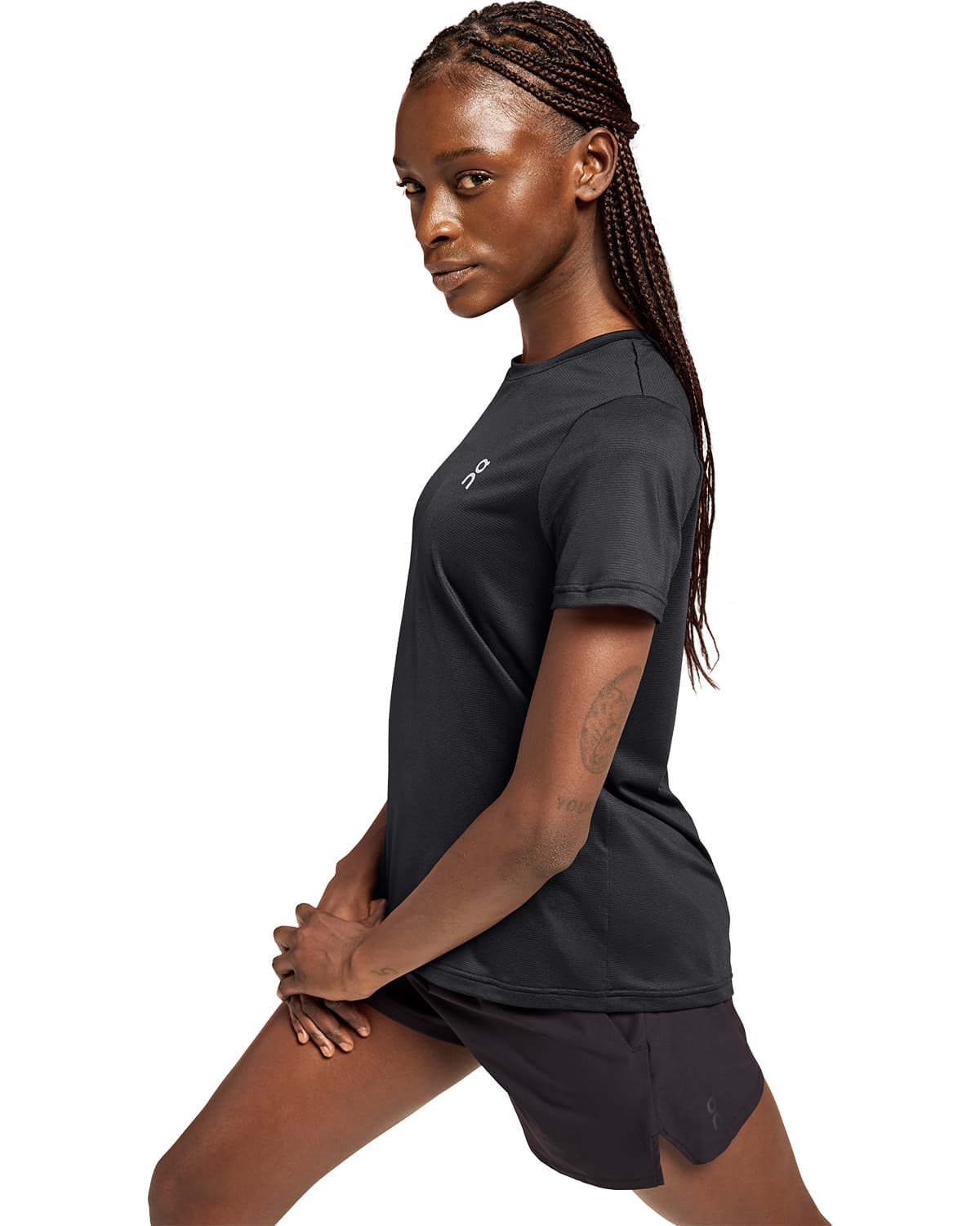 Women wearing the On Core T Colour Black - Front View Motion