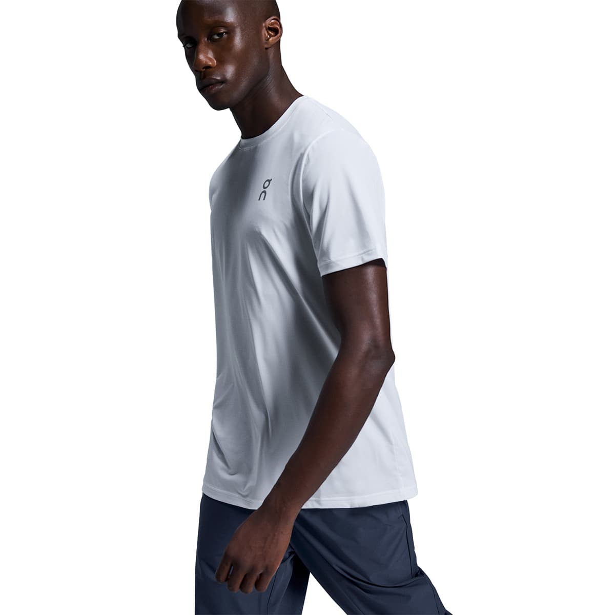 Man wearing the On Core T Colour White - Front View 45 Degree