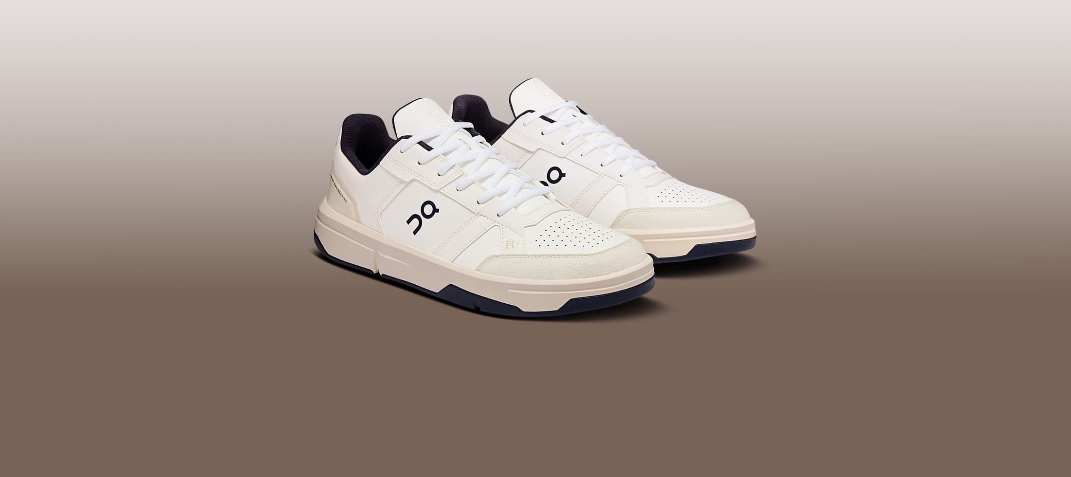 The Roger Clubhouse White sneakers with black soles on a beige background