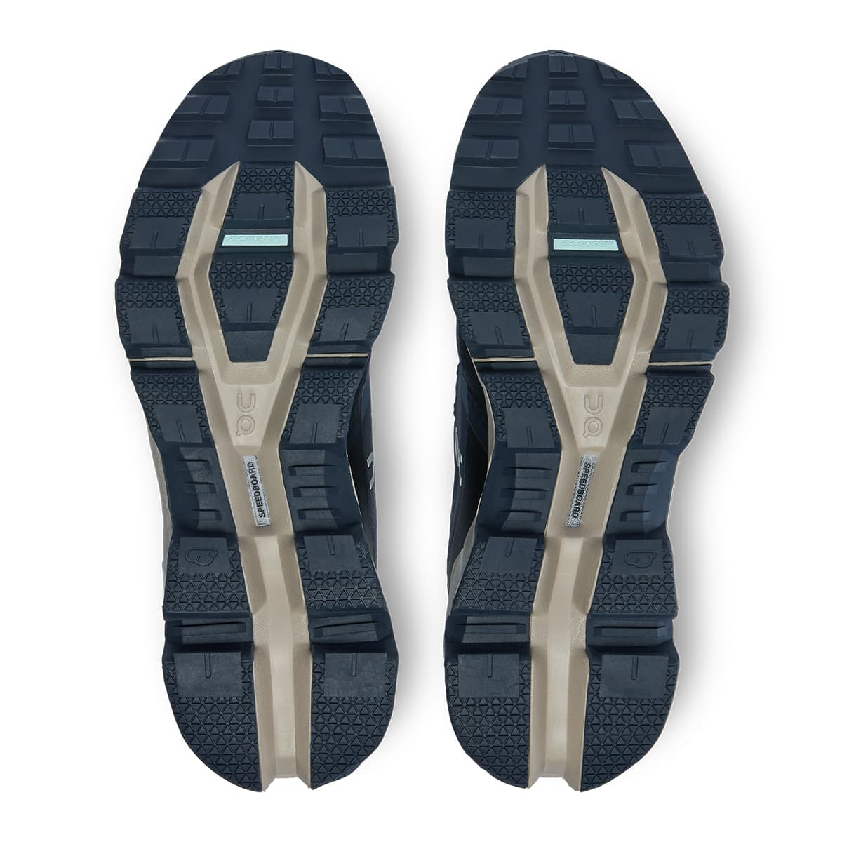 Soles of the On Cloudwander Waterproof Navy-Desert women’s running shoes