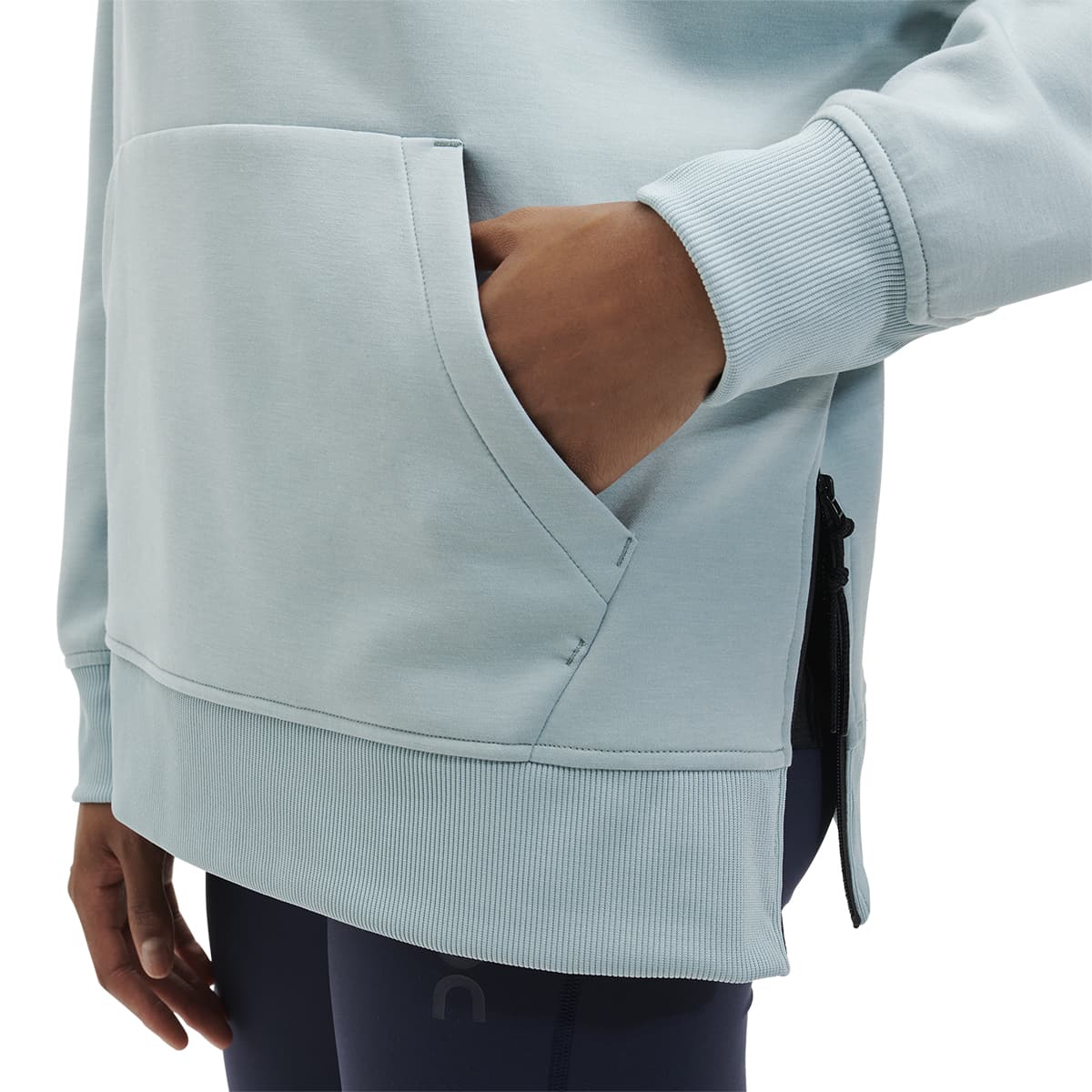 Product shot of the Women’s On Hoodie Colour Sea - Detail Front Pocket