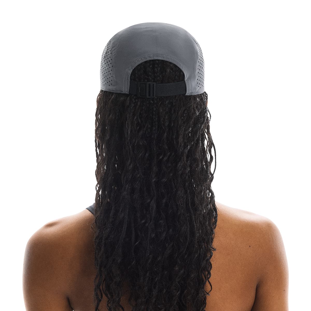 Rear view of female model wearing the On Lightweight Cap in Rock showing adjustable strap