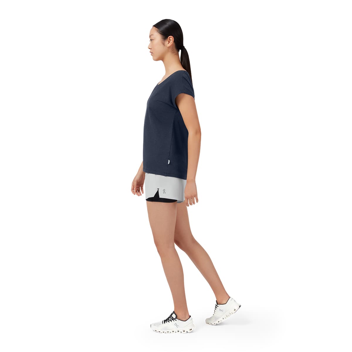 Woman wearing the On On T Colour Navy - Side Angle