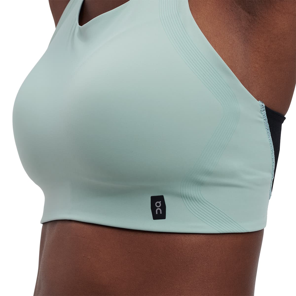 Woman wearing the On Performance Bra Colour Sea-Black - Close up Front - lining