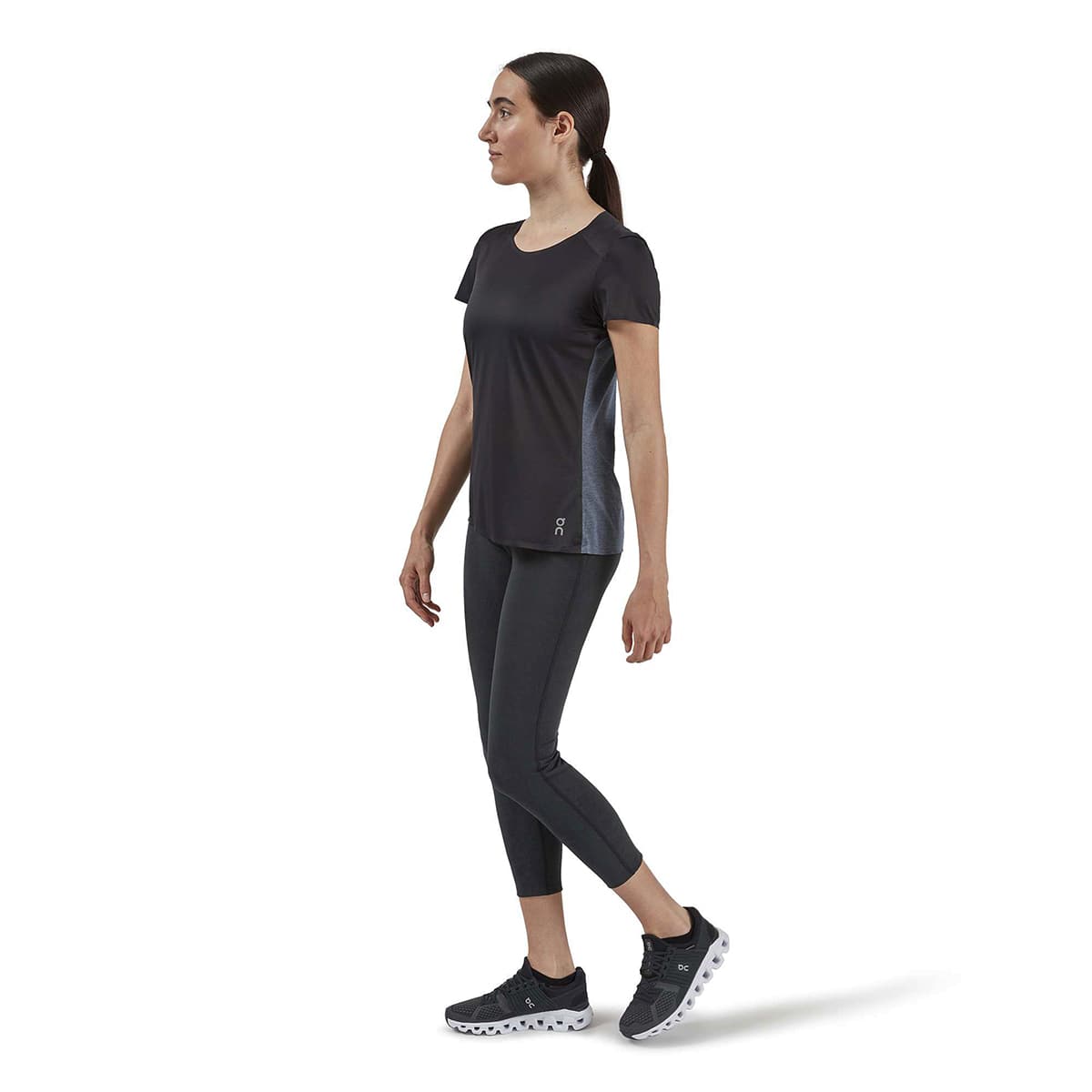Woman wearing the On Performance T Colour Black Dark - Side Angle