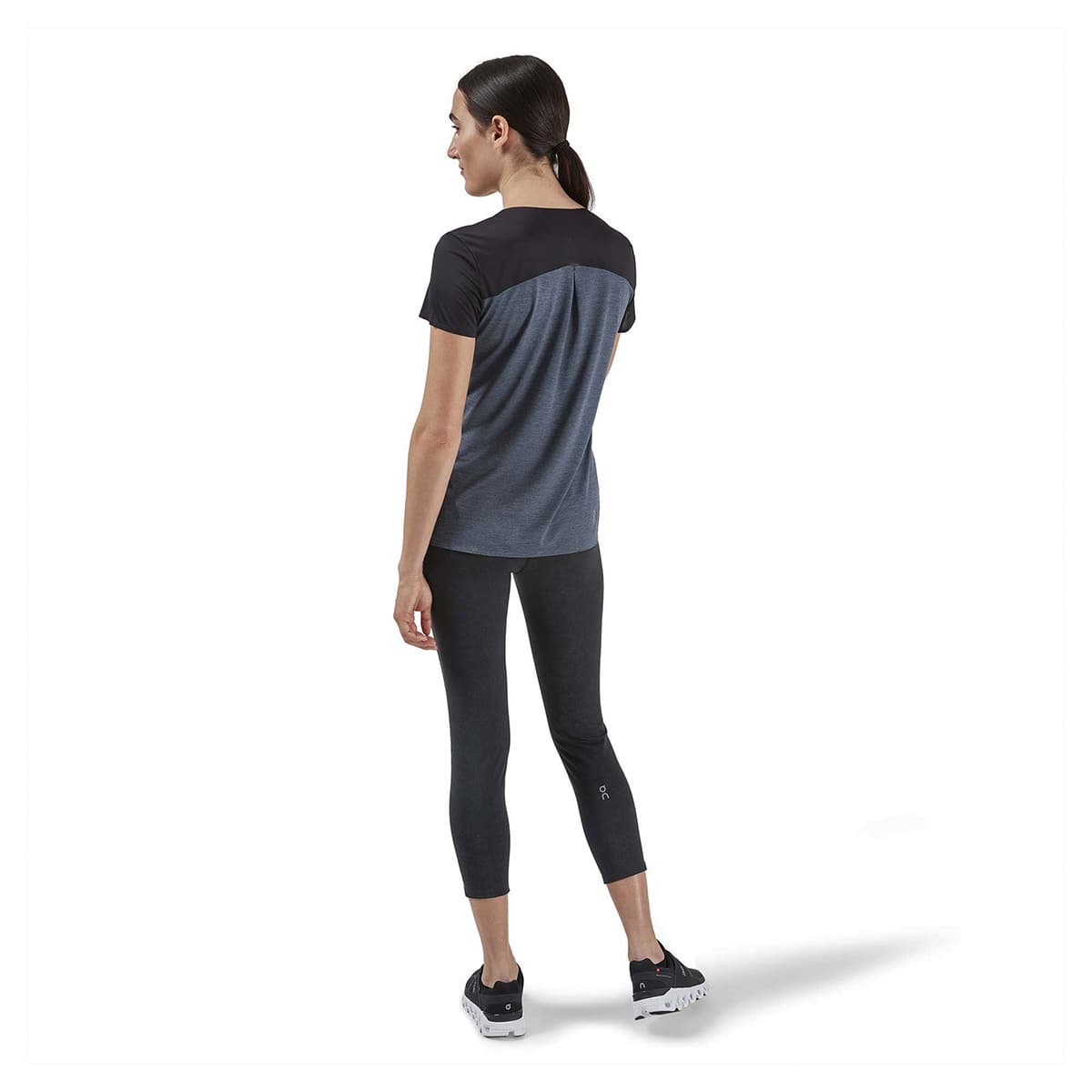 Woman wearing the On Performance T Colour Black Dark - Back View