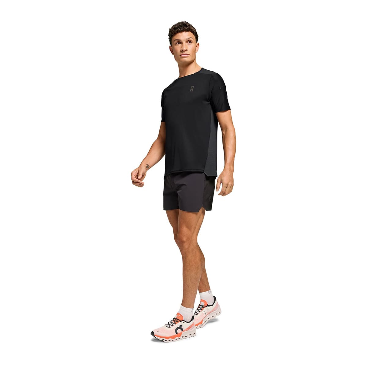 Man wearing the On Performance T Colour Black-Eclipse - Front View Side Angle #color_black-eclipse