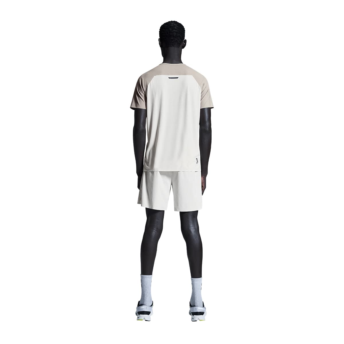 Man wearing the On Performance T Colour Cinder-Silver - Back View