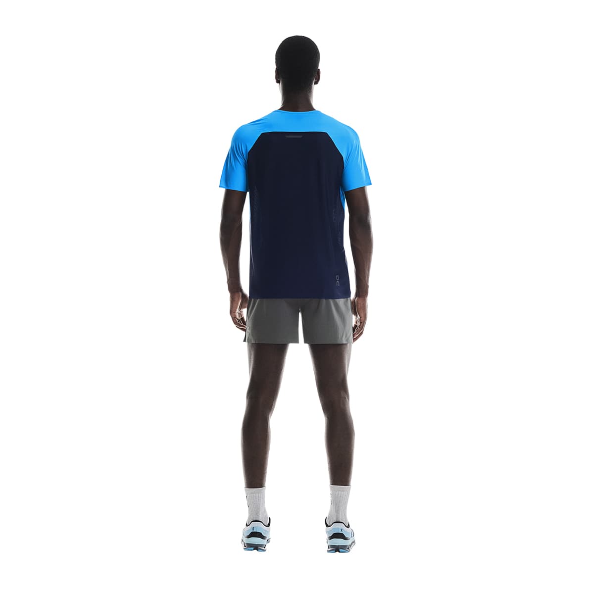 Man wearing the On Performance T Colour Malibu-Navy - Back View