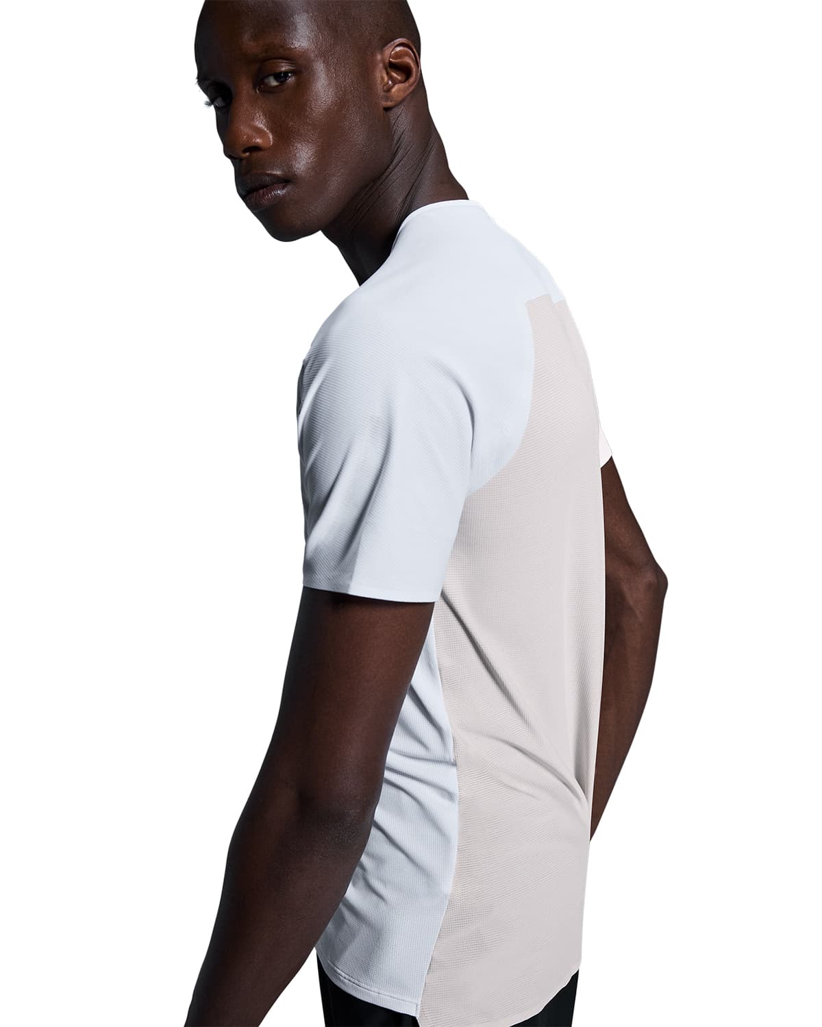 Man wearing the On Performance T Colour White Silver - side profile