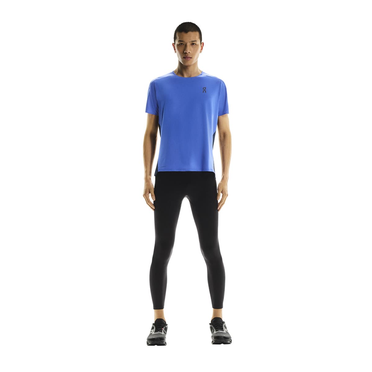 Full front view of male model wearing the On Performance T in Zaffre Navy