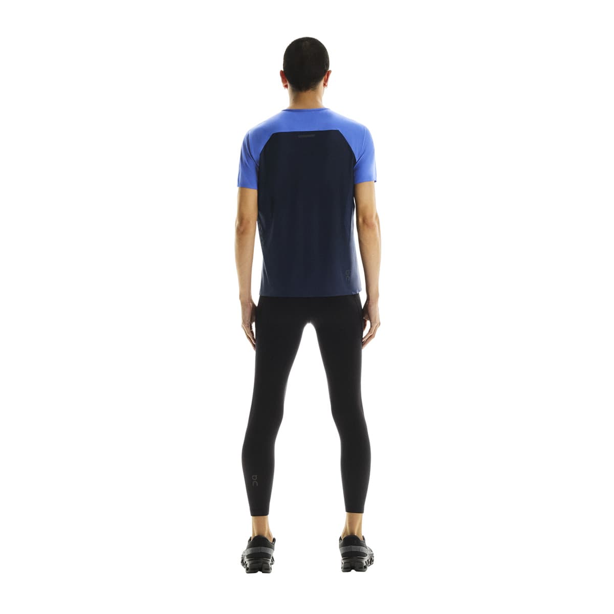 Full back view of male model wearing the On Performance T in Zaffre Navy