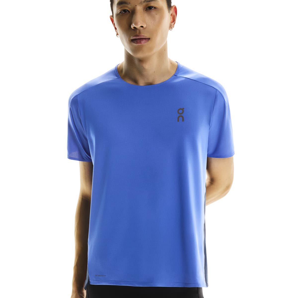 Front close-up of male model wearing the On Performance T in Zaffre Navy