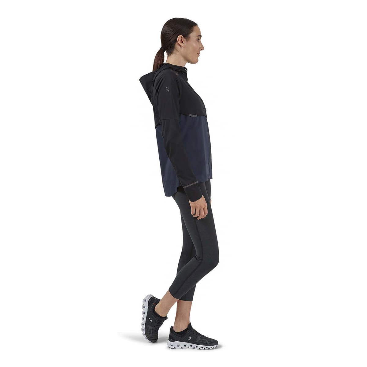 Woman wearing the On Weather Jacket Colour Black Navy - Side Profile