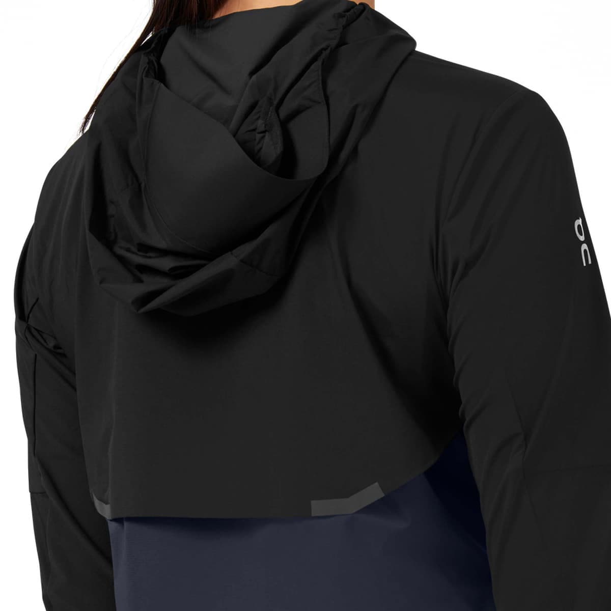 Woman wearing the On Weather Jacket Colour Black Navy - Back View Hoodie Down