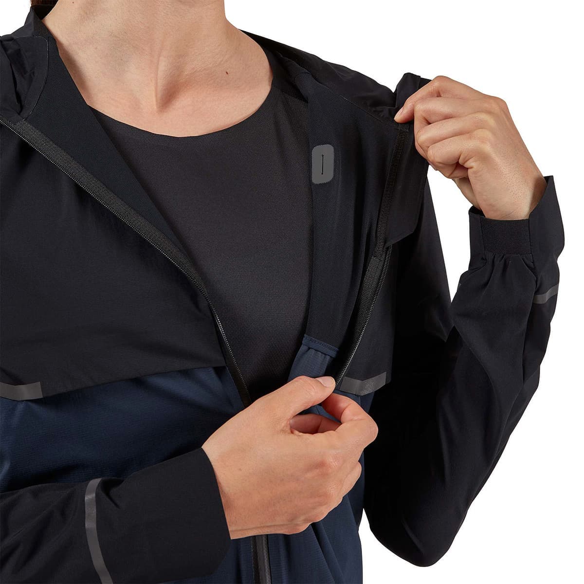 Woman wearing the On Weather Jacket Colour Black Navy - Front Inside Lining
