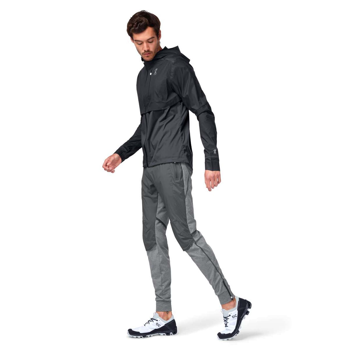 Man wearing the On Weather Jacket Colour Black Shadow - Front Side View