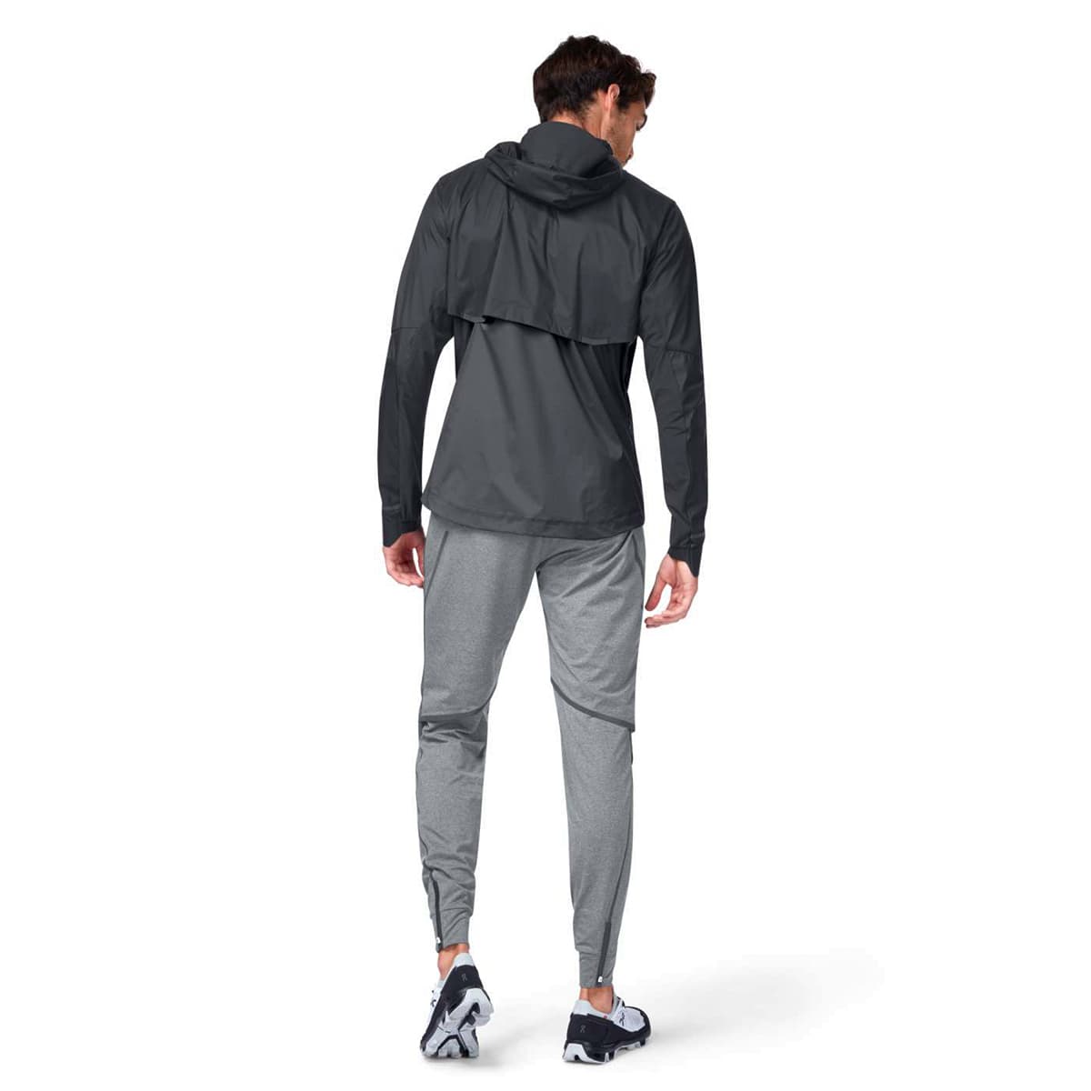 Man wearing the On Weather Jacket Colour Black Shadow - Back View