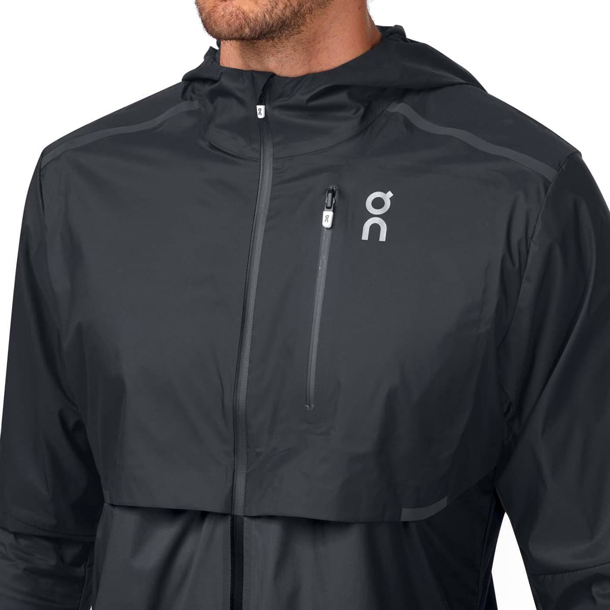 Man wearing the On Weather Jacket Colour Black Shadow - Front Secure Pocket Pocket