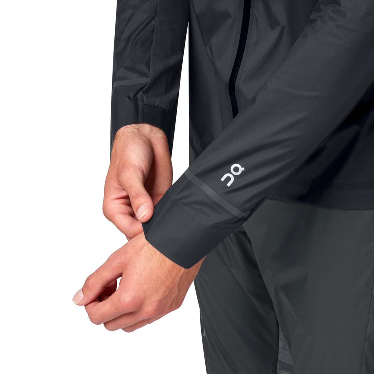 Man wearing the On Weather Jacket Colour Black Shadow - Close Up of Sleeve