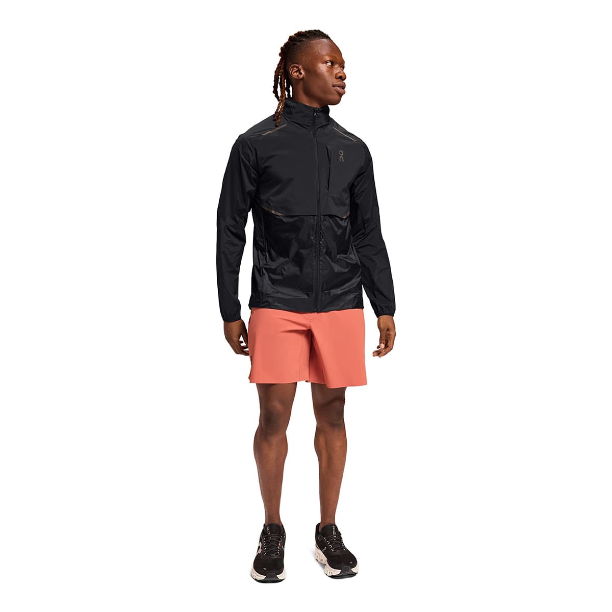 Man wearing the On Weather Jacket Colour Black - Front Side Profile