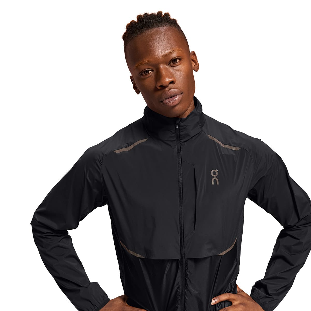 Man wearing the On Weather Jacket Colour Black - Front Reflective Details