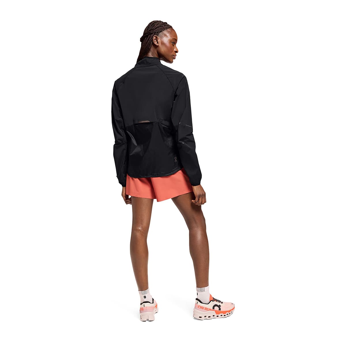 Woman wearing the On Weather Jacket Colour Black - Back View
