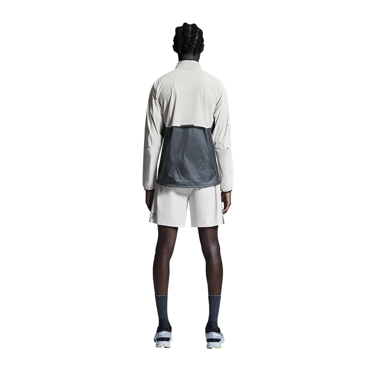 Man wearing the On Weather Jacket Colour Silver-Eclipse - back view