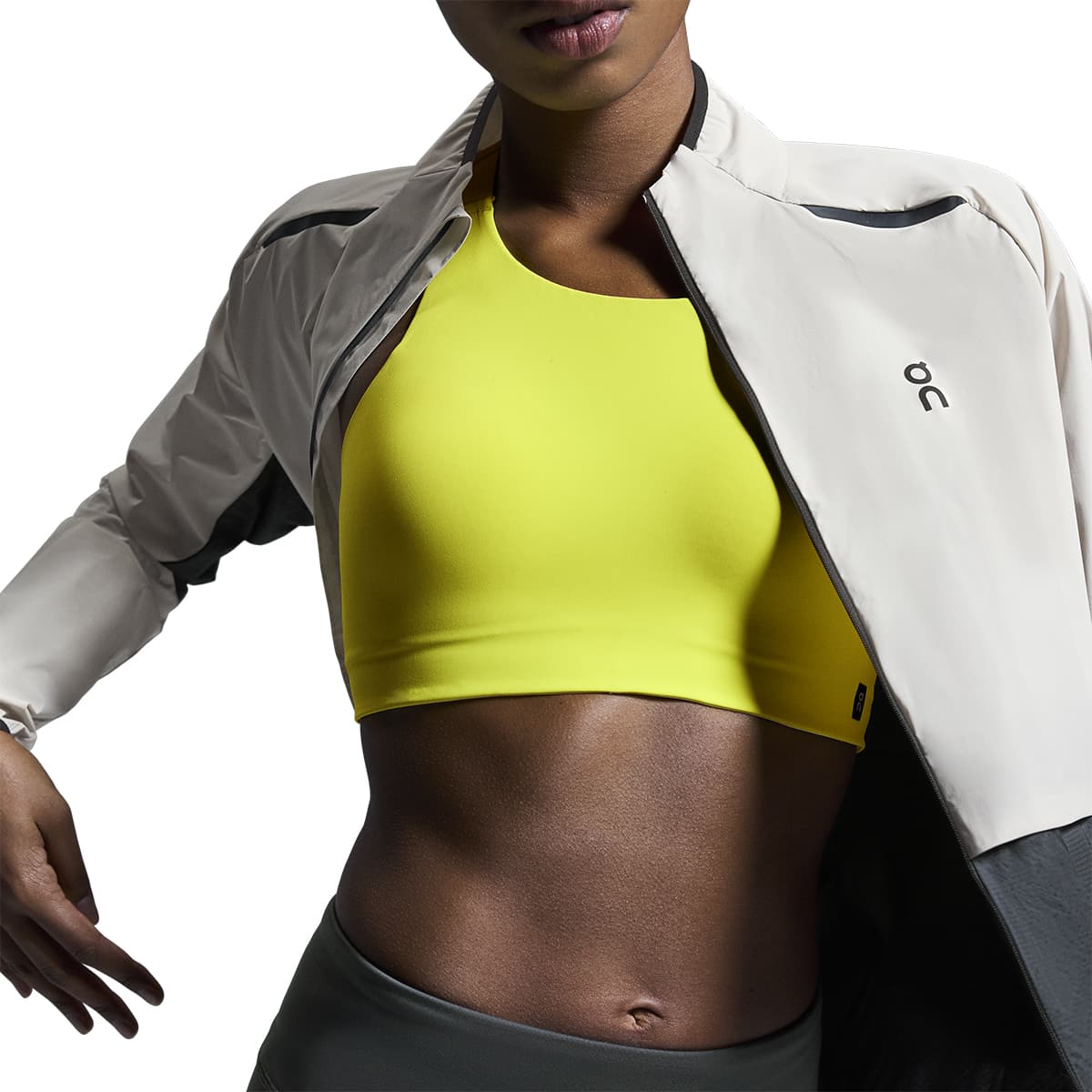 Woman wearing the On Weather Jacket Colour Silver Eclipse - Front Light weight and open