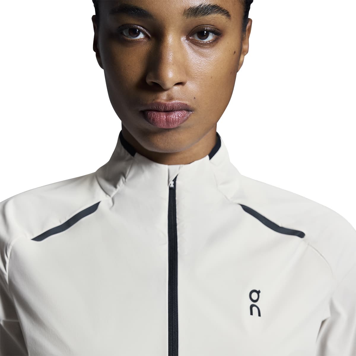 Woman wearing the On Weather Jacket Colour Silver Eclipse - Front Reflective Detail