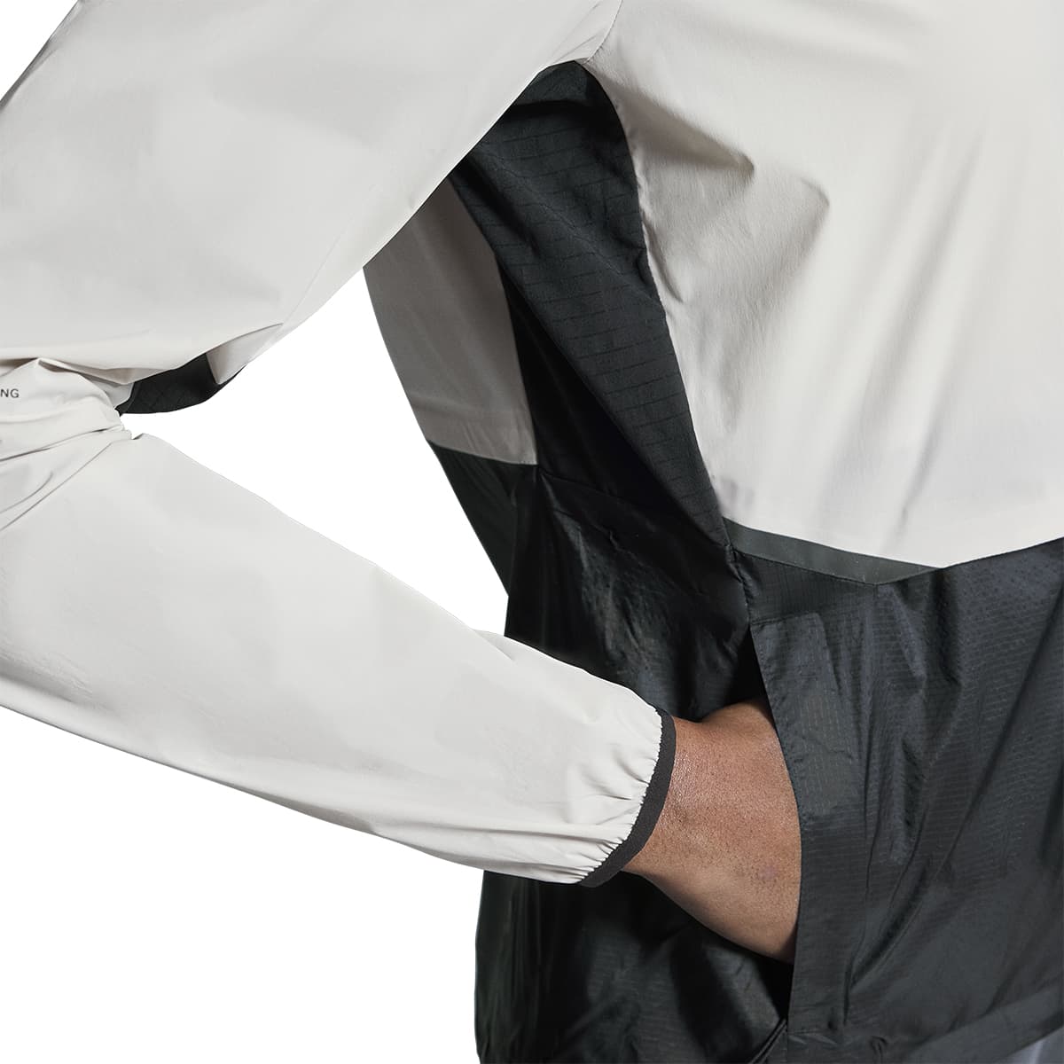 Woman wearing the On Weather Jacket Colour Silver Eclipse - Front Left Pocket
