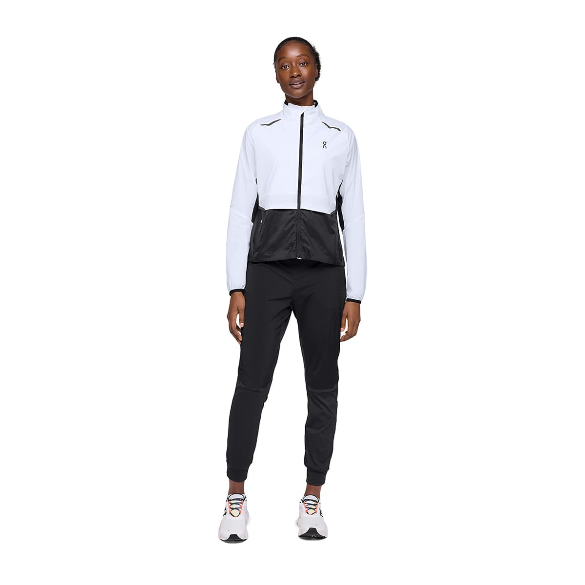Woman wearing the On Weather Jacket Colour White Black - Front View