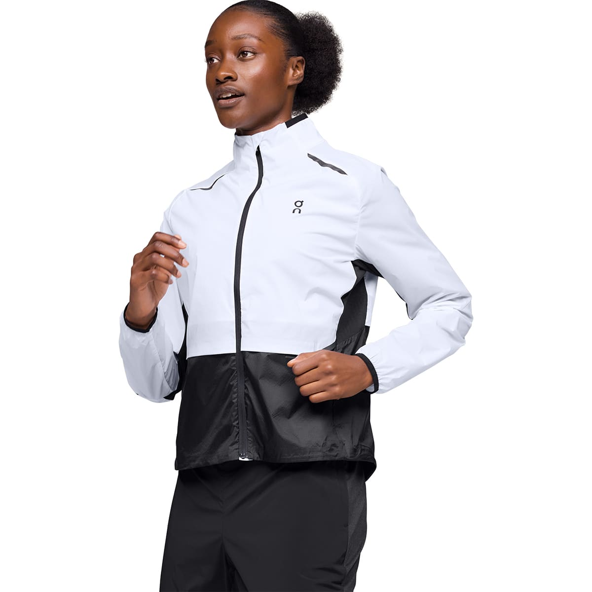 Woman wearing the On Weather Jacket Colour White Black - Motion