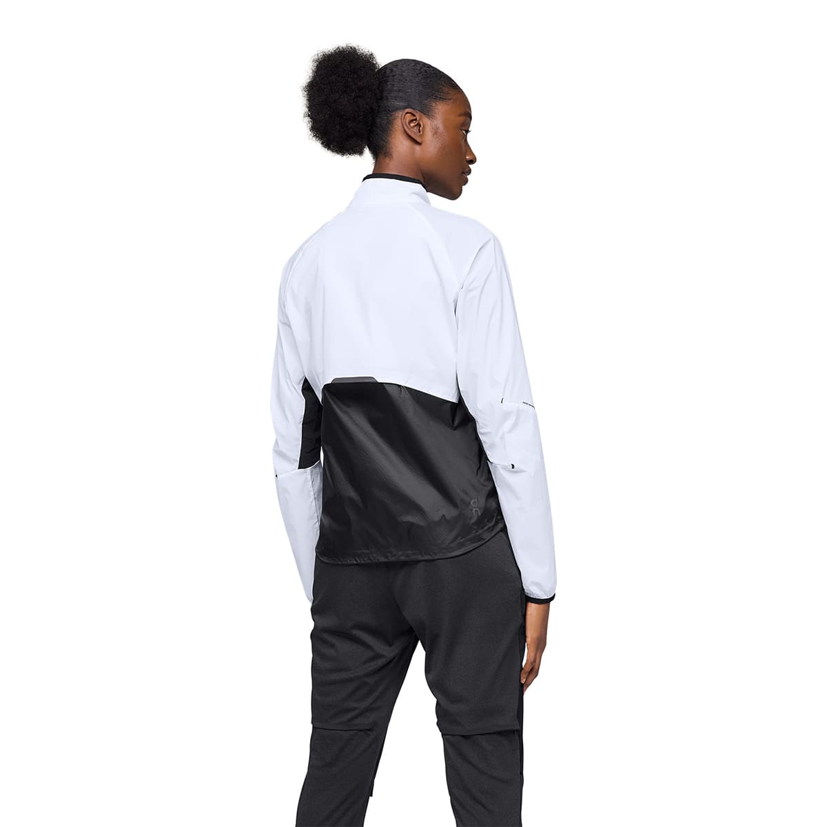 Woman wearing the On Weather Jacket Colour White Black - Back View
