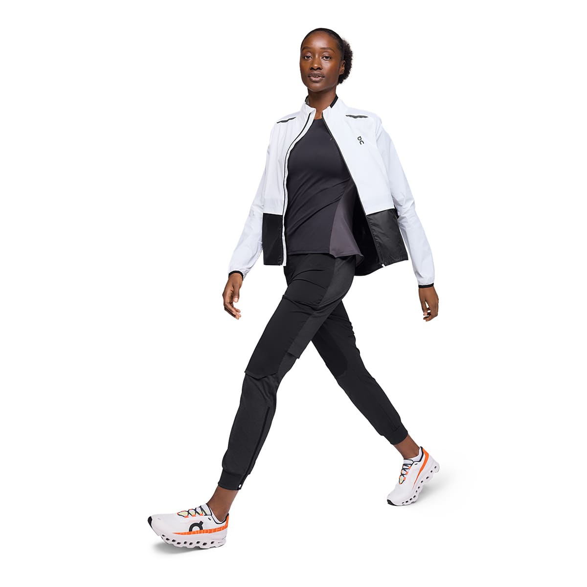 Woman wearing the On Weather Jacket Colour White Black - Front View Jacket Open