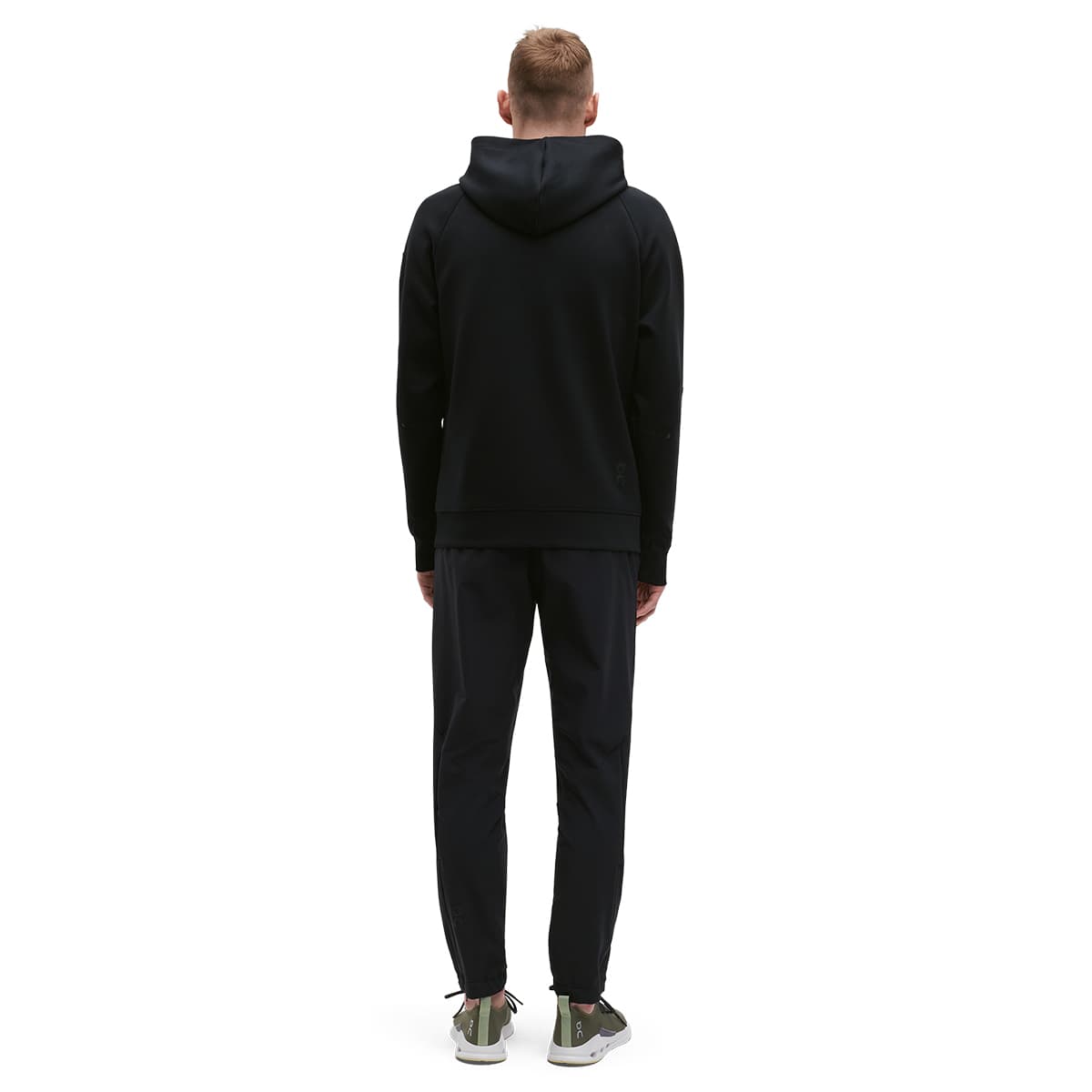 Man wearing the On Zipped Hoodie Colour black - Back View #color_black