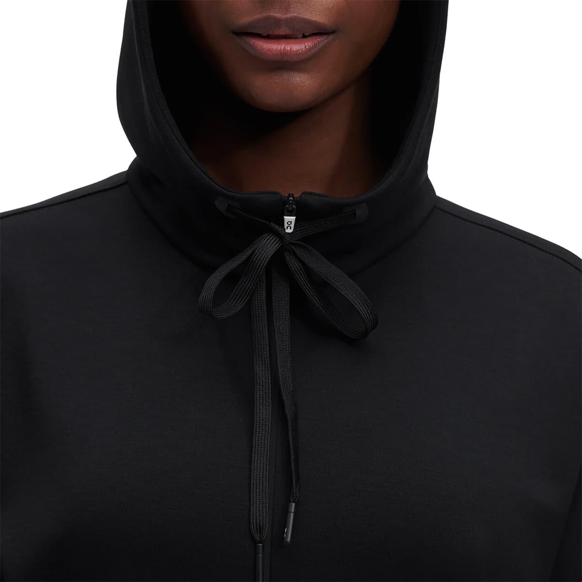 Woman wearing the On Zipped Hoodie Colour black - Close up Front Draw Strings
