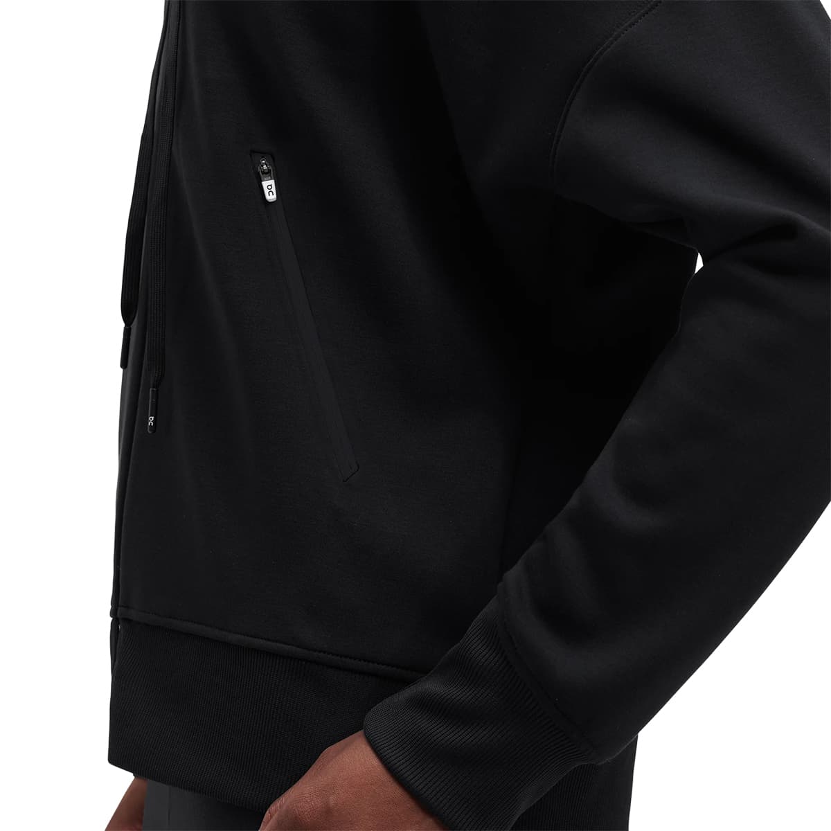 Woman wearing the On Zipped Hoodie Colour black - Left Secure Pocket Detail