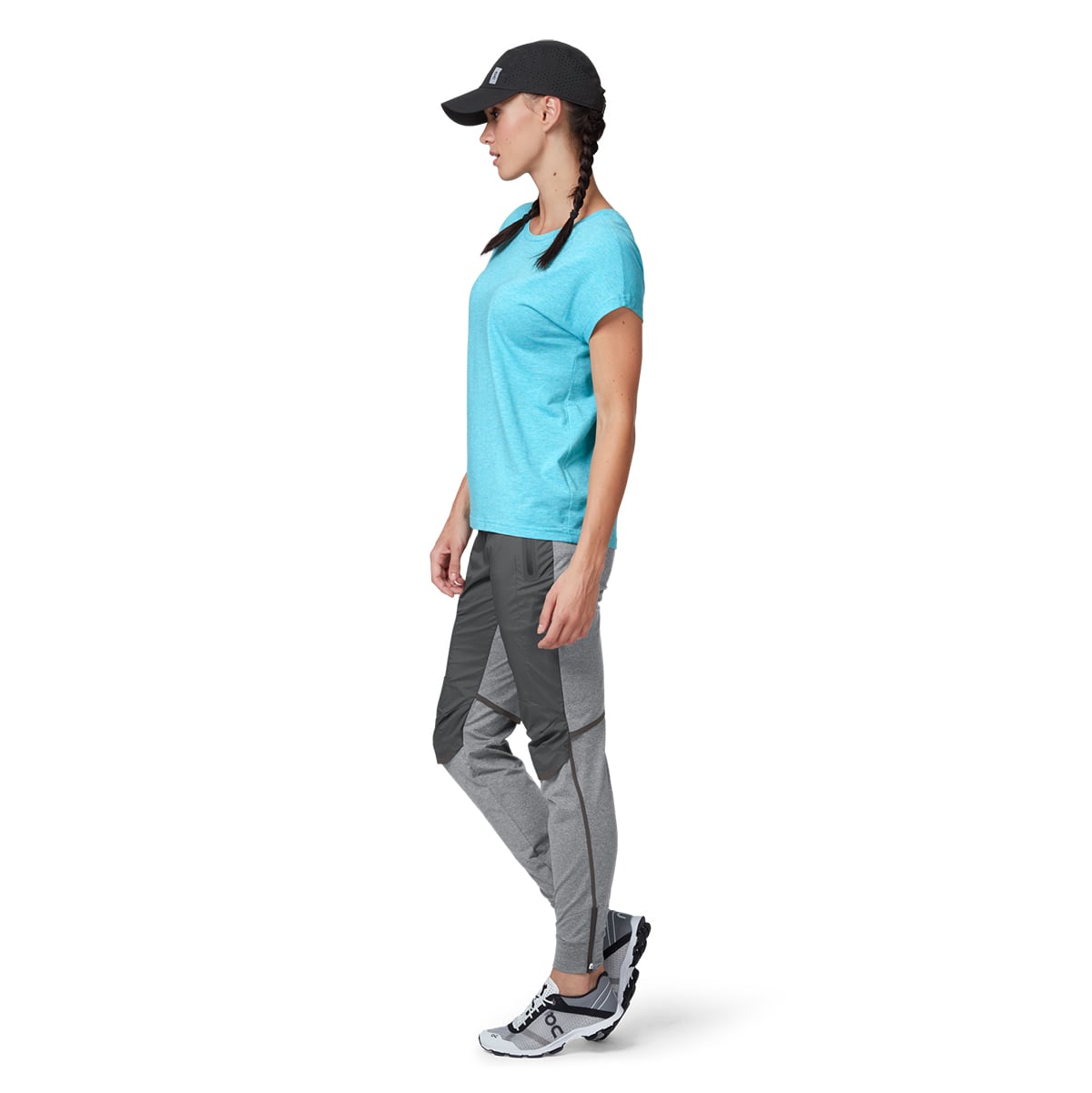 Female Model wearing the On Lightweight Cap Colour Black - Side Profile