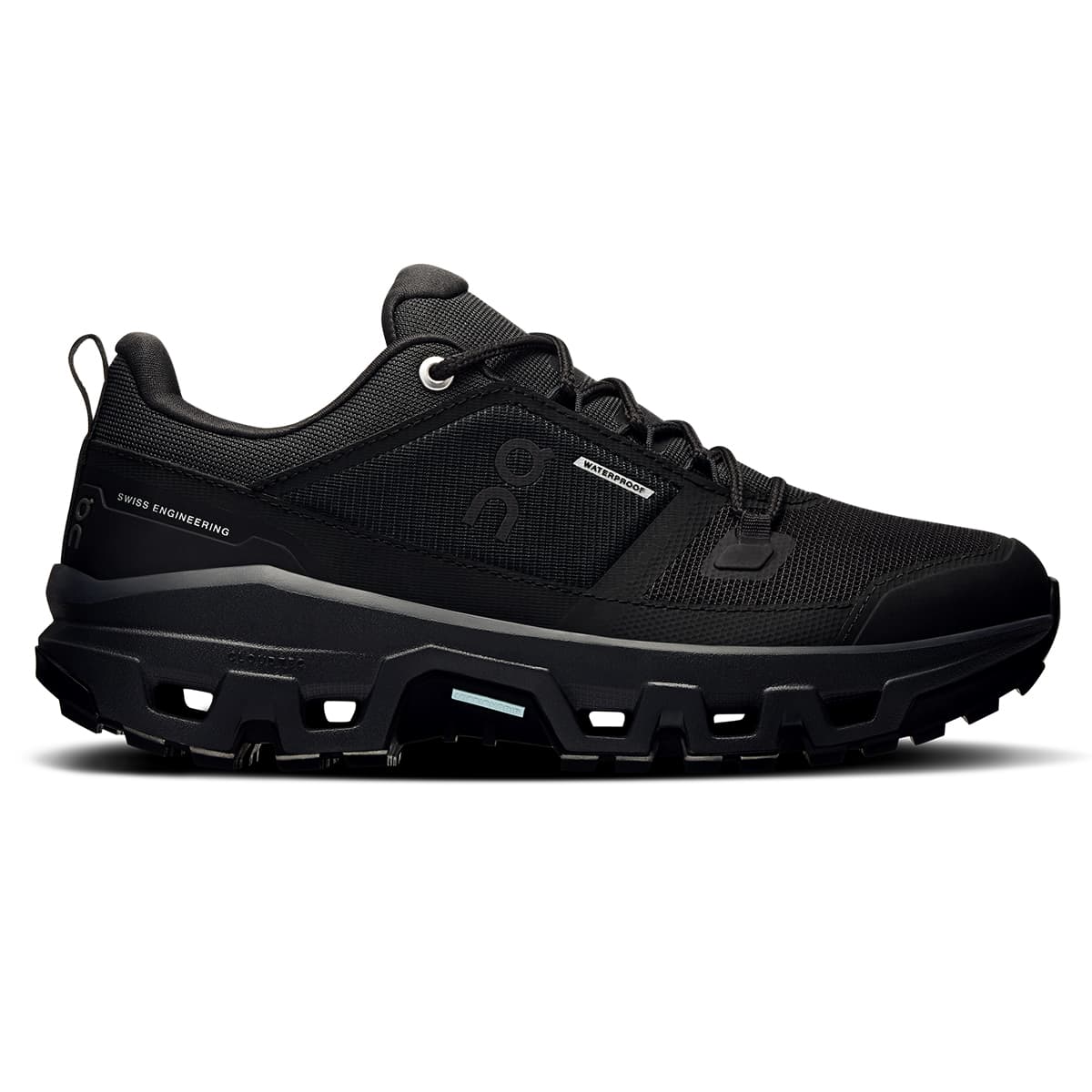 Right side view of the On Cloudrock Low Black Black women’s running shoe #color_black-black