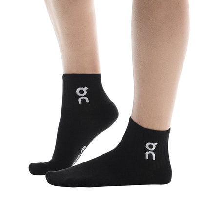Model wearing the On Logo Sock Mid 3P Colour Black - Side Angle 