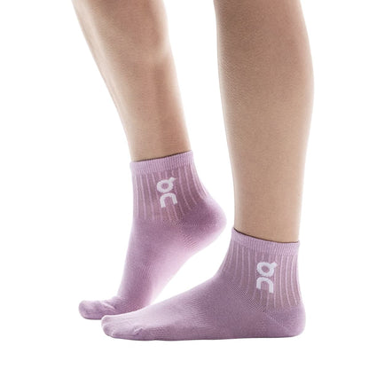 Model wearing the On Logo Sock Mid 3P Colour Mauve Lavendula - Side Angle 