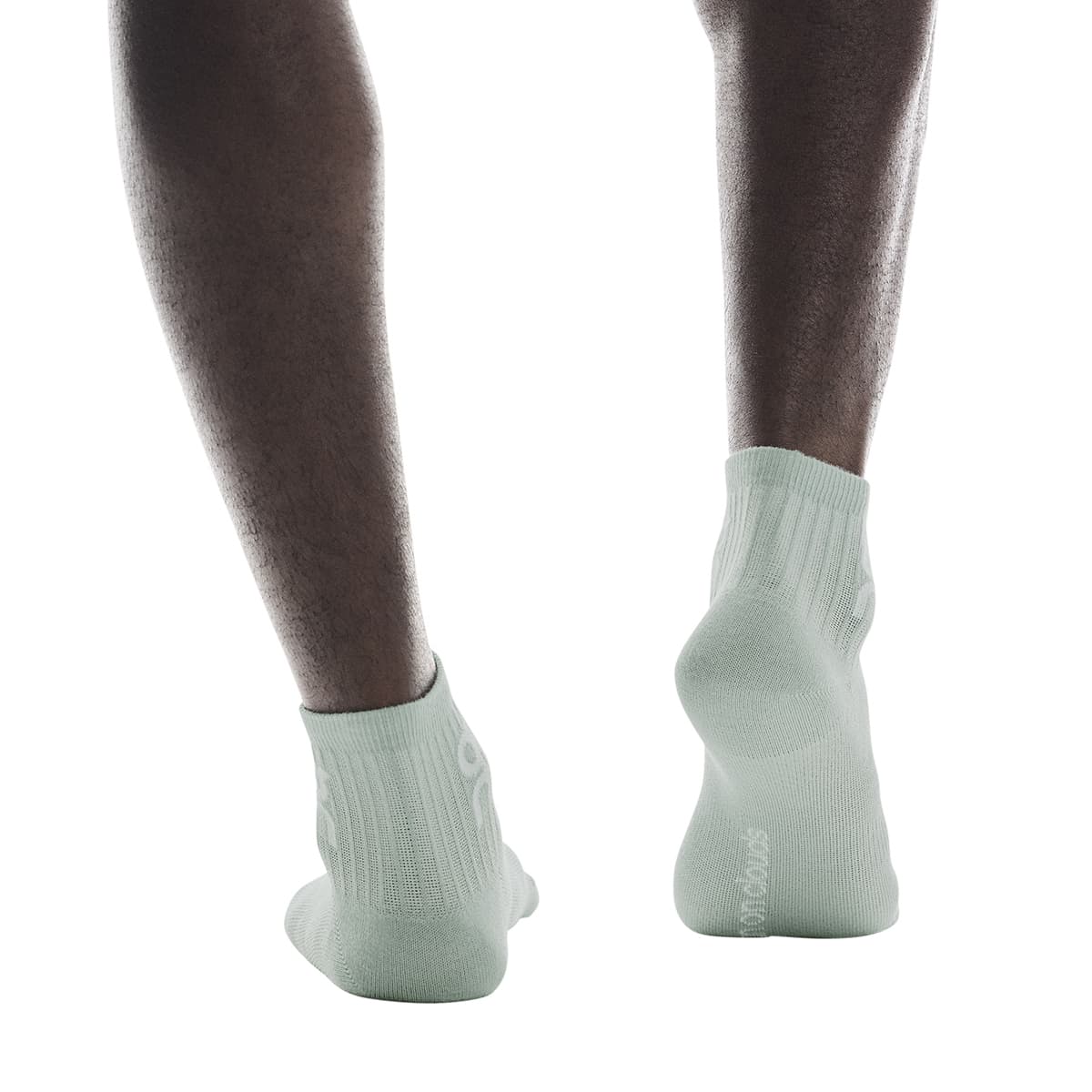 Model wearing the On Logo Sock Mid 3P Colour Wash Navy - Back Angle 