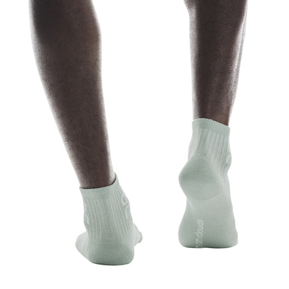 Model wearing the On Logo Sock Mid 3P Colour Wash Navy - Back Angle 