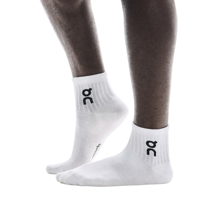 Model wearing the On Logo Sock Mid 3P Colour White - Side Angle 