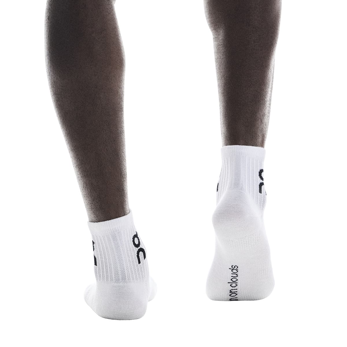 Model wearing the On Logo Sock Mid 3P Colour White - Back Angle 